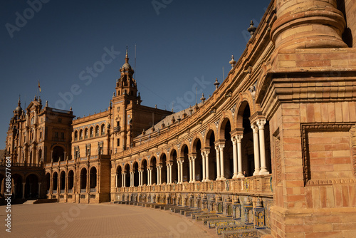 The National Geographic Institute in Plaza de España Seville city Spain. Central government offices in stunning rich wealthy architecture design on sunny day. Impressive symmetrical masonry 