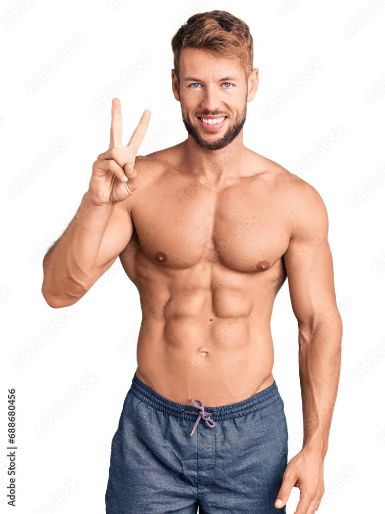 Young caucasian man standing shirtless showing and pointing up with fingers number two while smiling confident and happy. Young caucasian man standing shirtless showing and pointing up with fingers number two while smiling confident and happy.