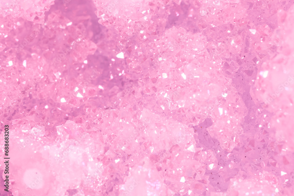 Amethyst pink crystals. Gems. Mineral crystals in the natural environment. Texture of precious and semiprecious stones. Seamless background with copy space colored shiny surface of precious stones. Amethyst pink crystals. Gems. Mineral crystals in the natural environment. Texture of precious and semiprecious stones. Seamless background with copy space colored shiny surface of precious stones.