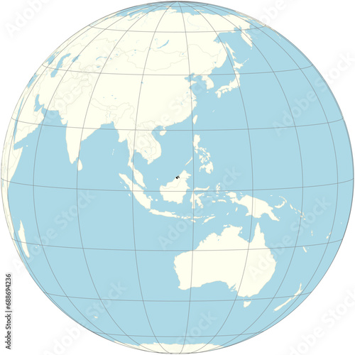 Brunei Darussalam positioned at the center of the world map in an orthographic projection. A tiny country in Southeast Asia, situated on the northern coast of the island of Borneo.  photo