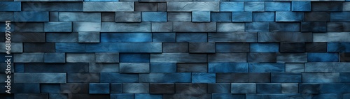A wall segmented into panels of progressively darkening shades of blue, offering a generous portion for text on the opposite side. photo