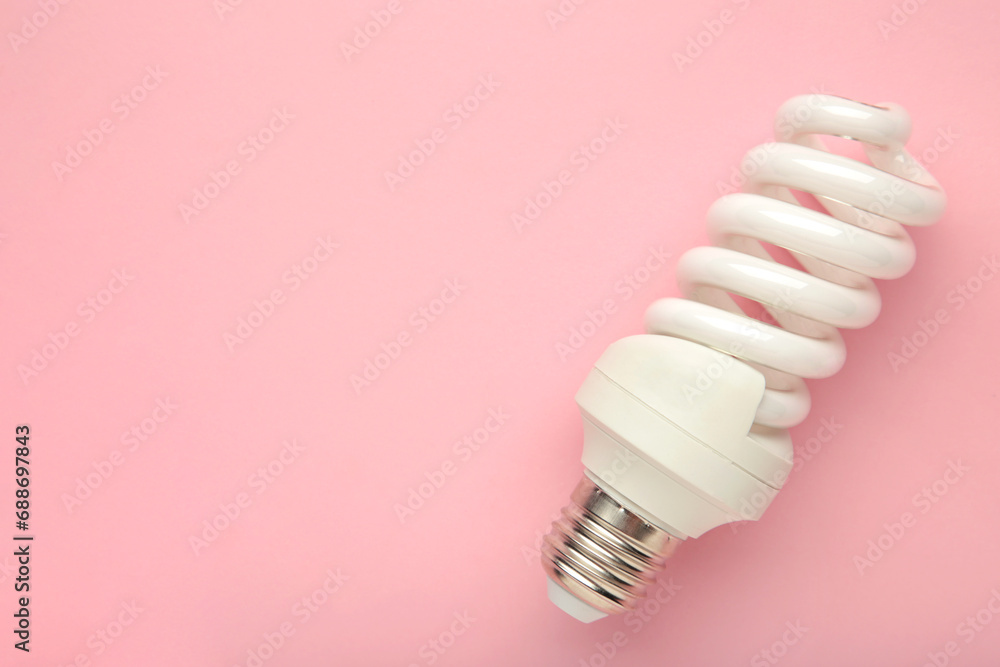 Light bulb on pink background. Space for text Light bulb on pink background. Space for text