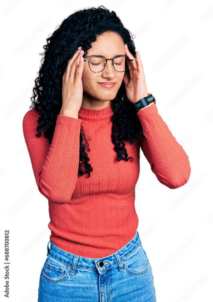Young hispanic woman with curly hair wearing glasses with hand on head, headache because stress. suffering migraine. Young hispanic woman with curly hair wearing glasses with hand on head, headache because stress. suffering migraine.