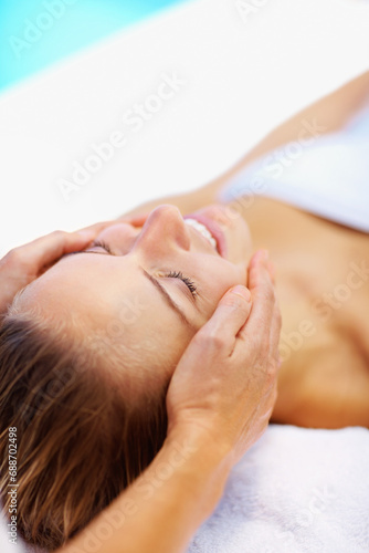 Woman, spa and face massage with therapist for wellness, holistic therapy and reiki at holiday resort. Beauty, skincare and happy client for facial acupressure, zen treatment and relax on vacation