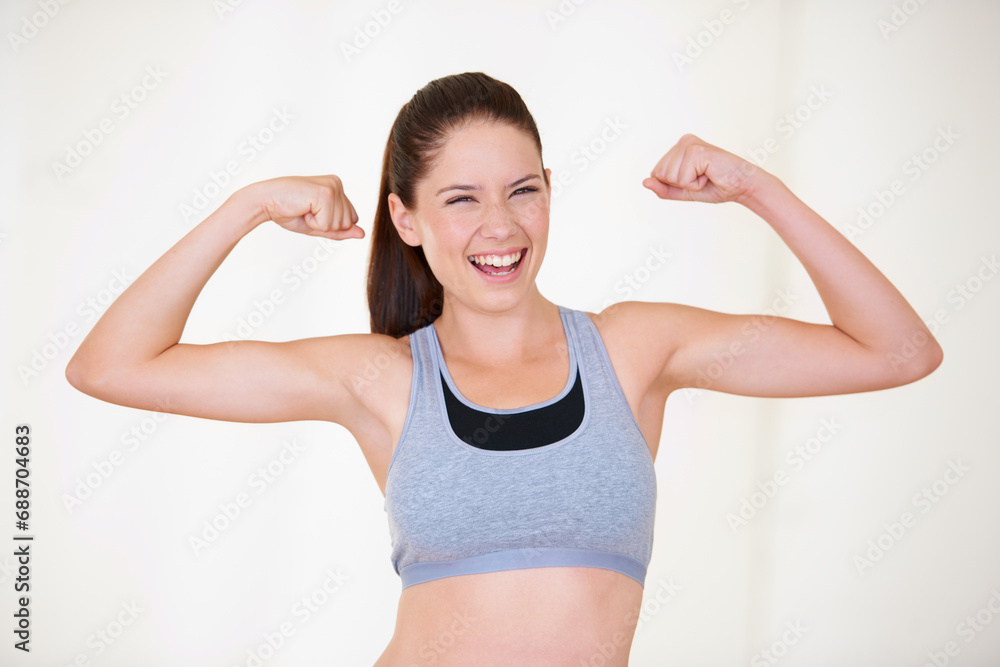 Woman, portrait or happy in studio with flex for fitness, wellness or workout strength with sportswear. Person, athlete or smile for biceps, exercise and training on white background or mock up space Woman, portrait or happy in studio with flex for fitness, wellness or workout strength with sportswear. Person, athlete or smile for biceps, exercise and training on white background or mock up space