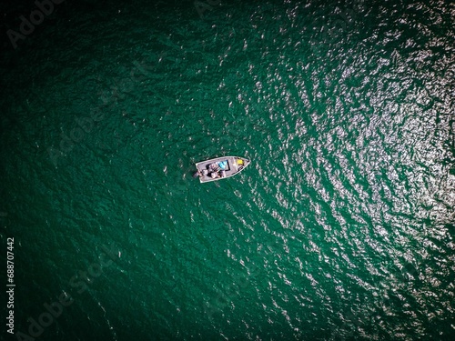 Drone picture from above of a boat on Lake Norfork, Arkansas, USA