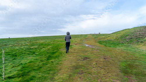 woman walking in a meadow