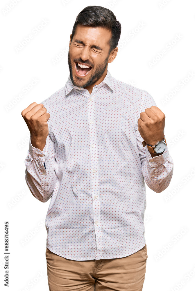 Handsome hispanic man wearing business clothes screaming proud, celebrating victory and success very excited with raised arms Handsome hispanic man wearing business clothes screaming proud, celebrating victory and success very excited with raised arms
