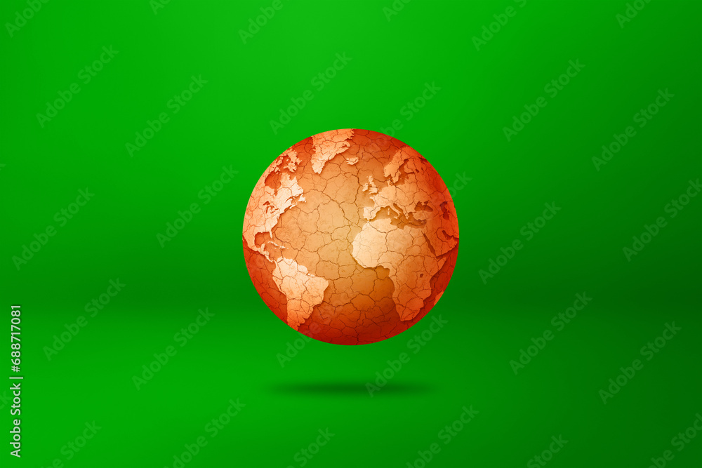 Dry and cracked world globe isolated on green background. Global warming symbol Dry and cracked world globe isolated on green background. Global warming symbol