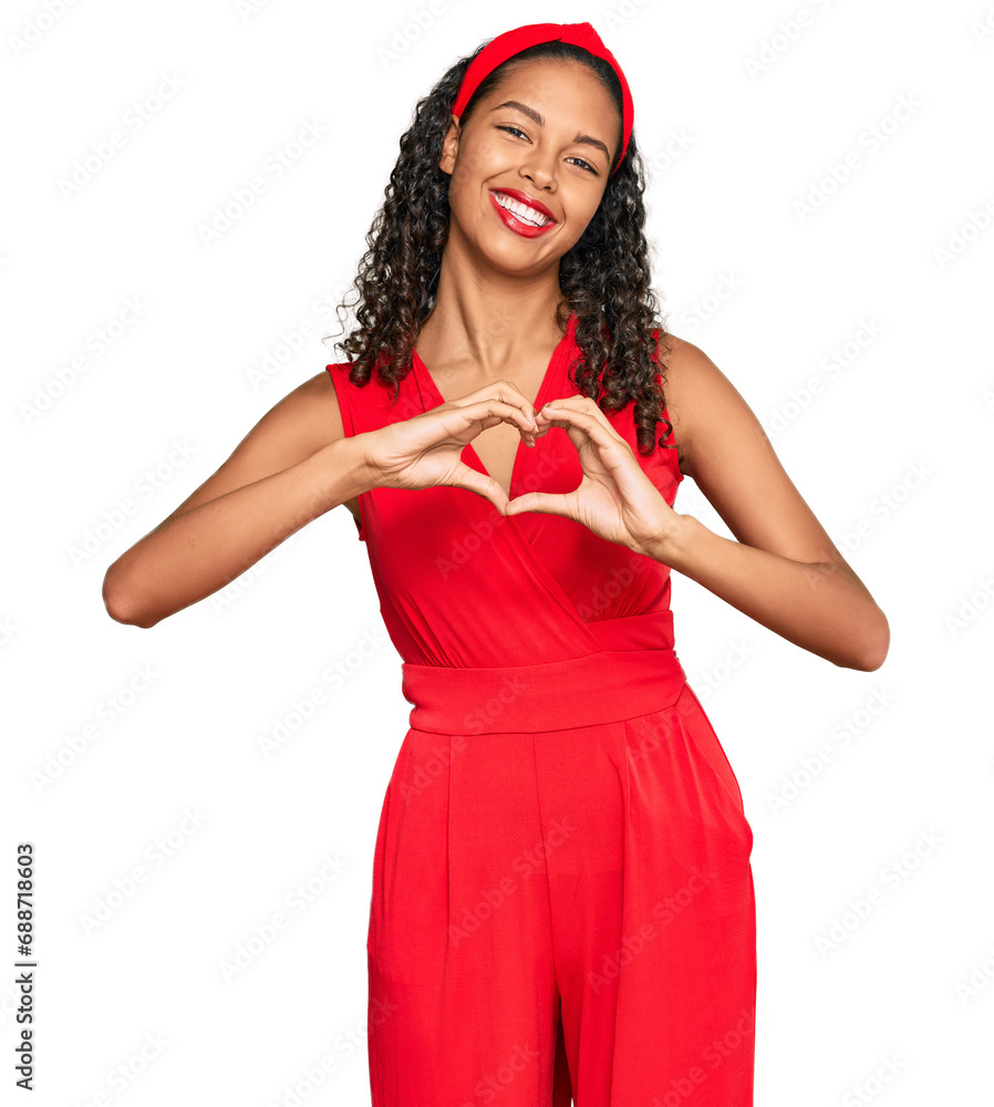 Young african american girl wearing elegant and sexy look smiling in love doing heart symbol shape with hands. romantic concept. Young african american girl wearing elegant and sexy look smiling in love doing heart symbol shape with hands. romantic concept.