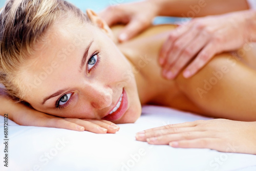 Woman, portrait and smile at spa for back massage wellness cosmetics or holistic therapy at holiday resort. Beauty salon, skincare and face of client relax for shoulder treatment, healing or vacation