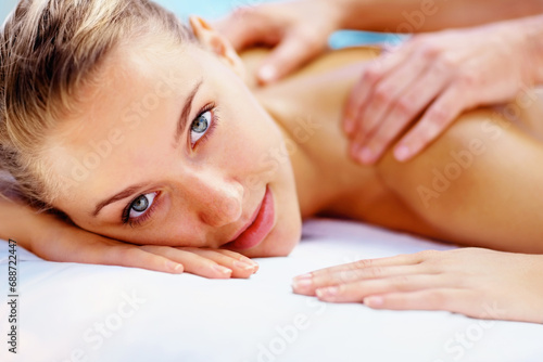 Woman, portrait and massage back with spa therapist for wellness, holistic therapy or cosmetic care at holiday resort. Beauty salon, skincare and face of client relax for treatment, break or vacation