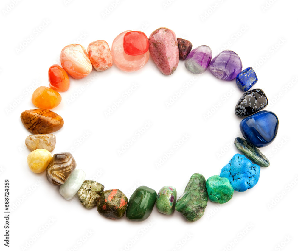 Color spectrum of crystallic semiprecious gemstones in oval border, isolated on white background, copy space Color spectrum of crystallic semiprecious gemstones in oval border, isolated on white background, copy space