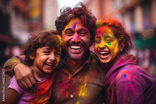 Father and Daughters Delighting in Holi Festival Celebrations