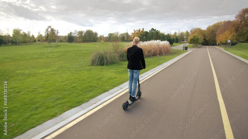 Beautiful well-kept territory of park with bicyle path, green trimmed lawns, multicolored trees anf bushes, coniferous trees, street lights and benches. High quality 4k footage Beautiful well-kept territory of park with bicyle path, green trimmed lawns, multicolored trees anf bushes, coniferous trees, street lights and benches. High quality 4k footage