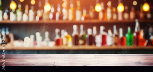 empty wooden bar counter on alcohol bottles background. banner photo