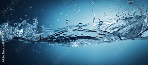 Closeup of bubbles splash water isolated in blue background
