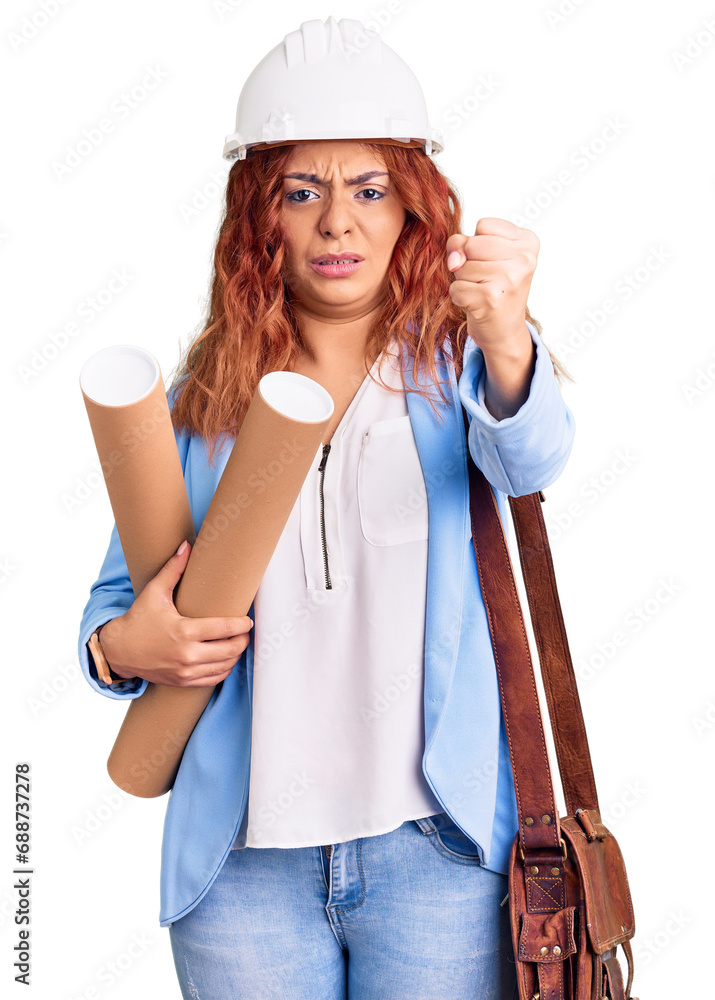 Young latin woman wearing architect hardhat holding blueprints annoyed and frustrated shouting with anger, yelling crazy with anger and hand raised Young latin woman wearing architect hardhat holding blueprints annoyed and frustrated shouting with anger, yelling crazy with anger and hand raised