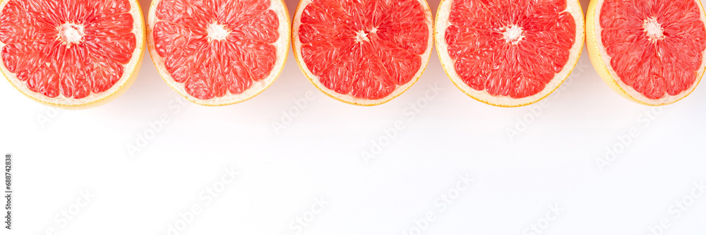 Fresh grapefruits on white table with copyspace Fresh grapefruits on white table with copyspace