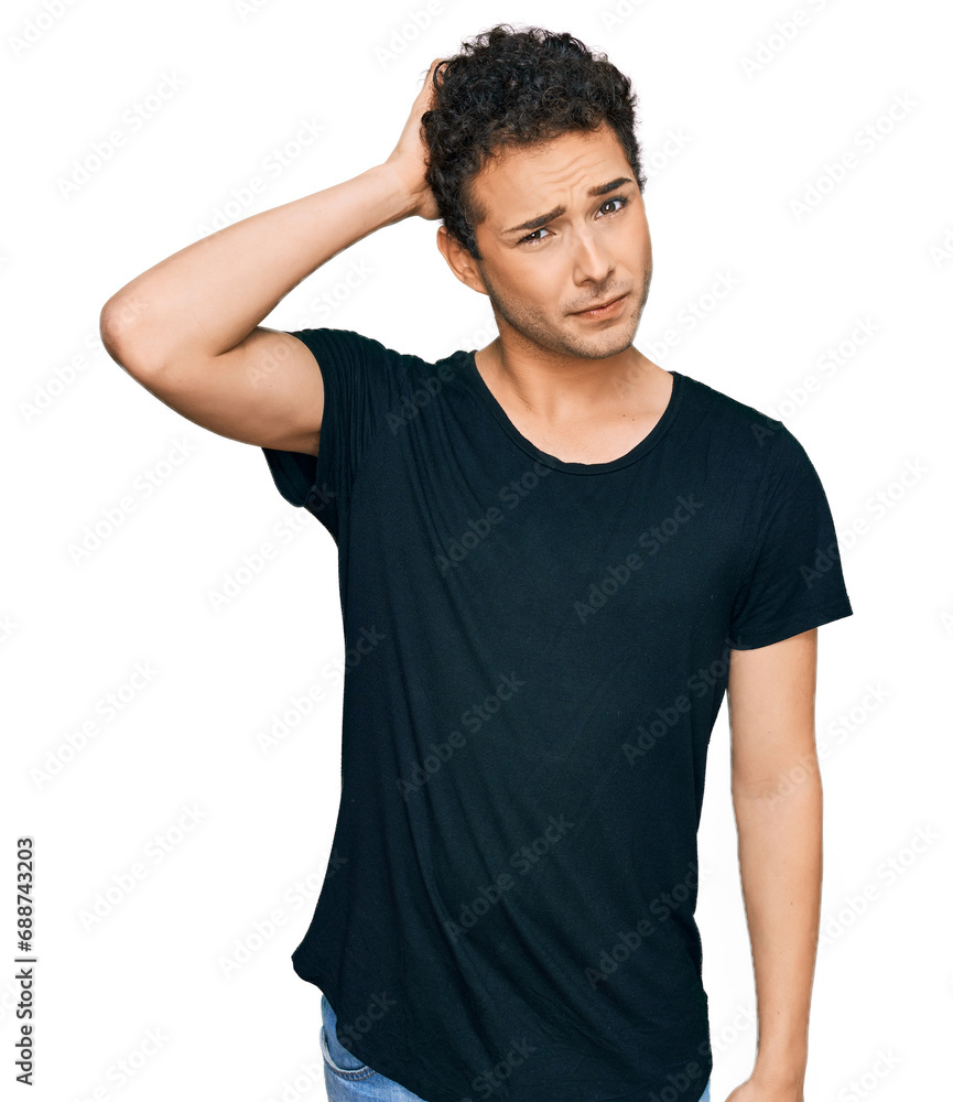 Fototapeta premium Young handsome man wearing casual black t shirt confuse and wonder about question. uncertain with doubt, thinking with hand on head. pensive concept.