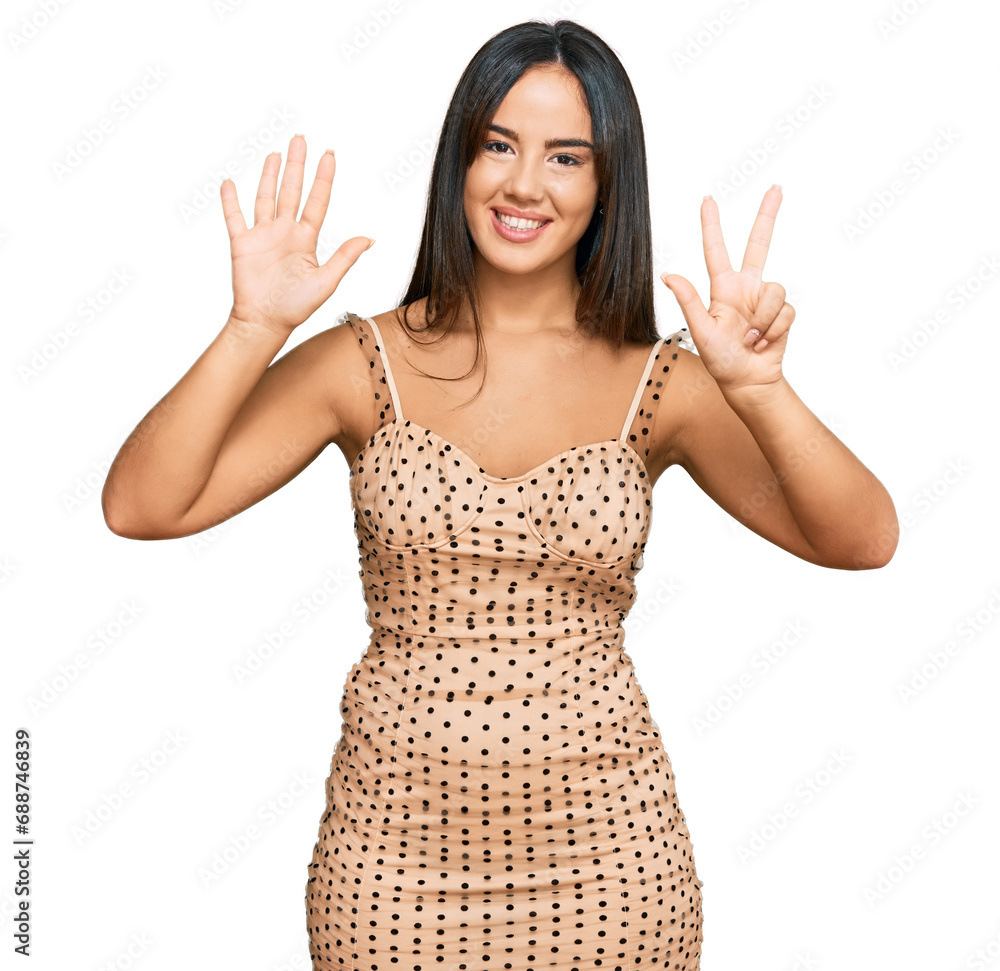 Young beautiful hispanic girl wearing sexy party dress showing and pointing up with fingers number eight while smiling confident and happy. Young beautiful hispanic girl wearing sexy party dress showing and pointing up with fingers number eight while smiling confident and happy.
