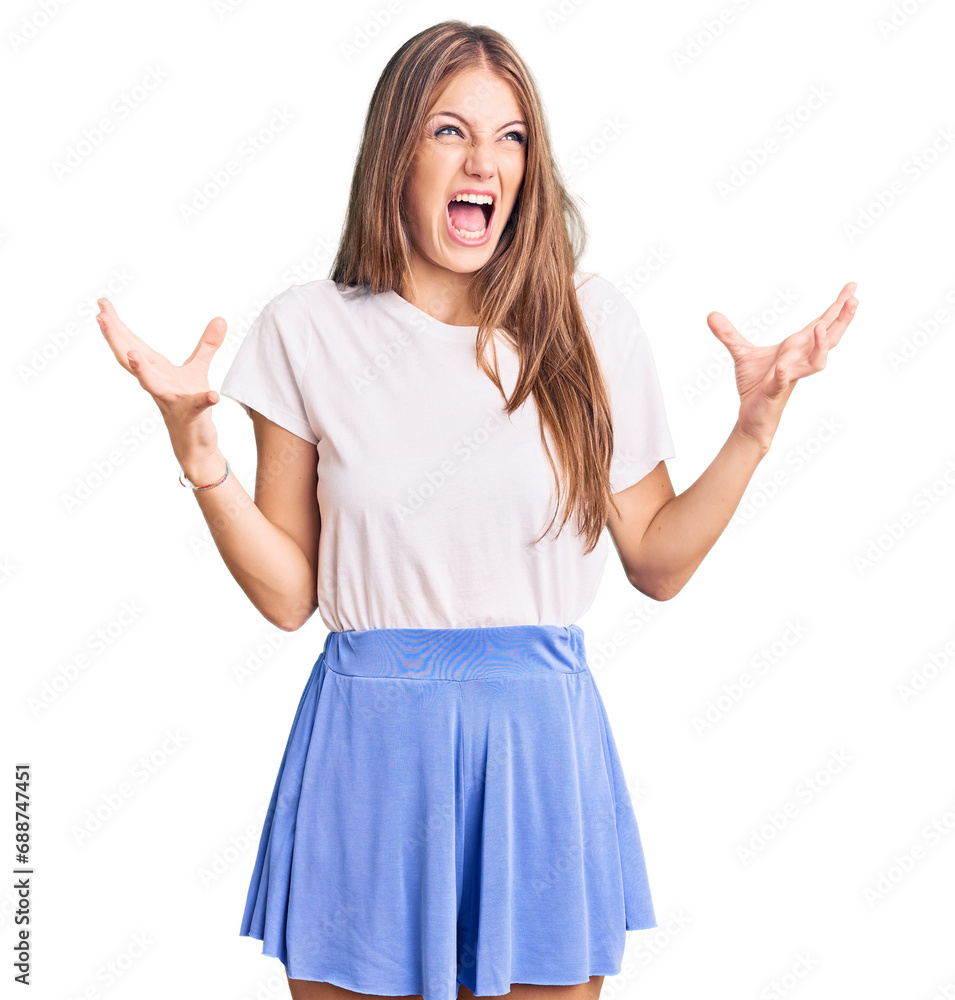 Φωτογραφία Young beautiful blonde woman wearing summer style crazy and mad shouting and yelling with aggressive expression and arms raised