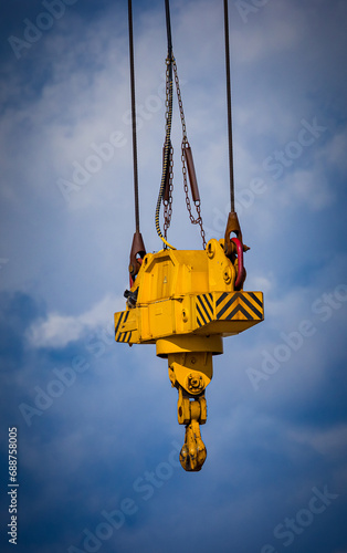 Bright yellow, Large industrial crain waiting to lift something heavy