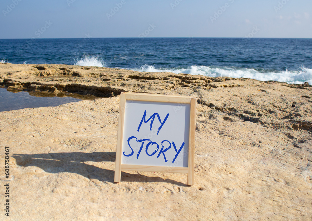 My story symbol. My story on white chalk background. Beautiful sea background. Business and My story concept. Copy space.