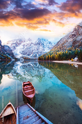 Obraz na płótnie Magical beautiful autumn landscape with boats on the lake on Fanes-Sennes-Braies natural park in the Dolomites Alps, Italy at sunset. ( inner peace, harmony - concept) w salonie