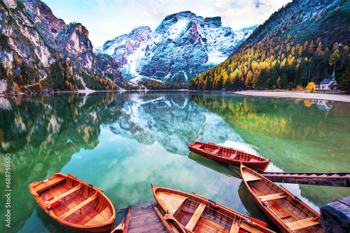 Magical autumn landscape with boats on the lake on Fanes-Sennes-Braies in the Dolomites Alps, Italy. (mental vacation, holiday, inner peace, harmony - concept)