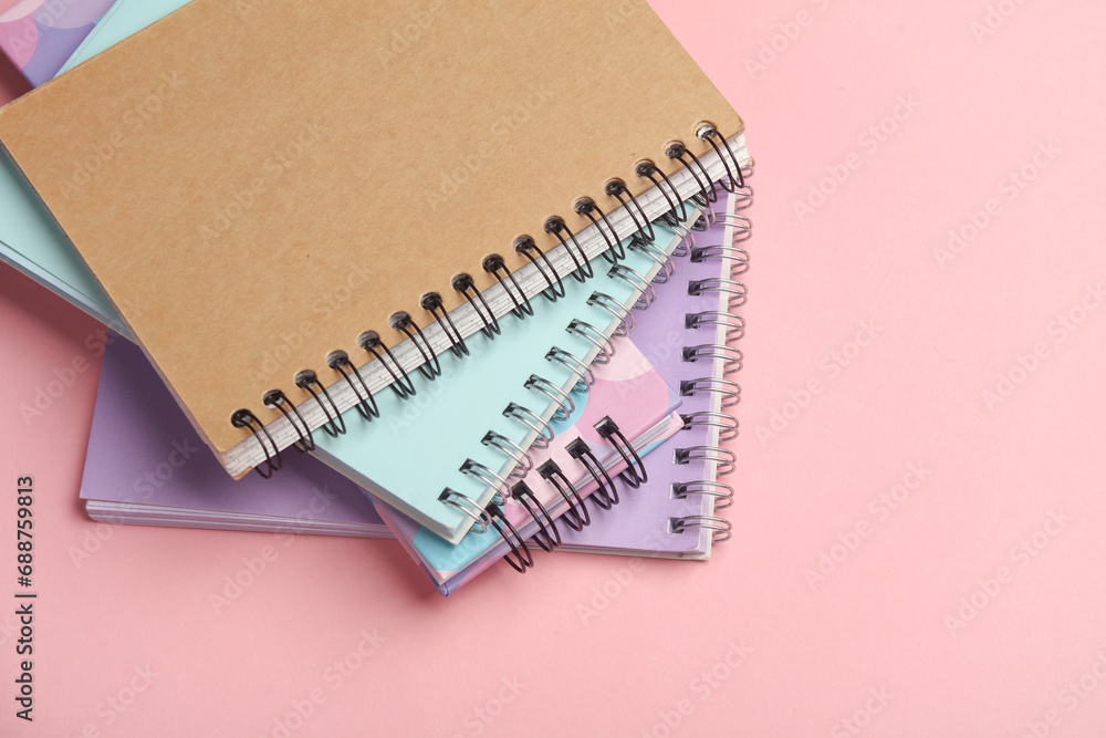Different notepads on a pink background Different notepads on a pink background