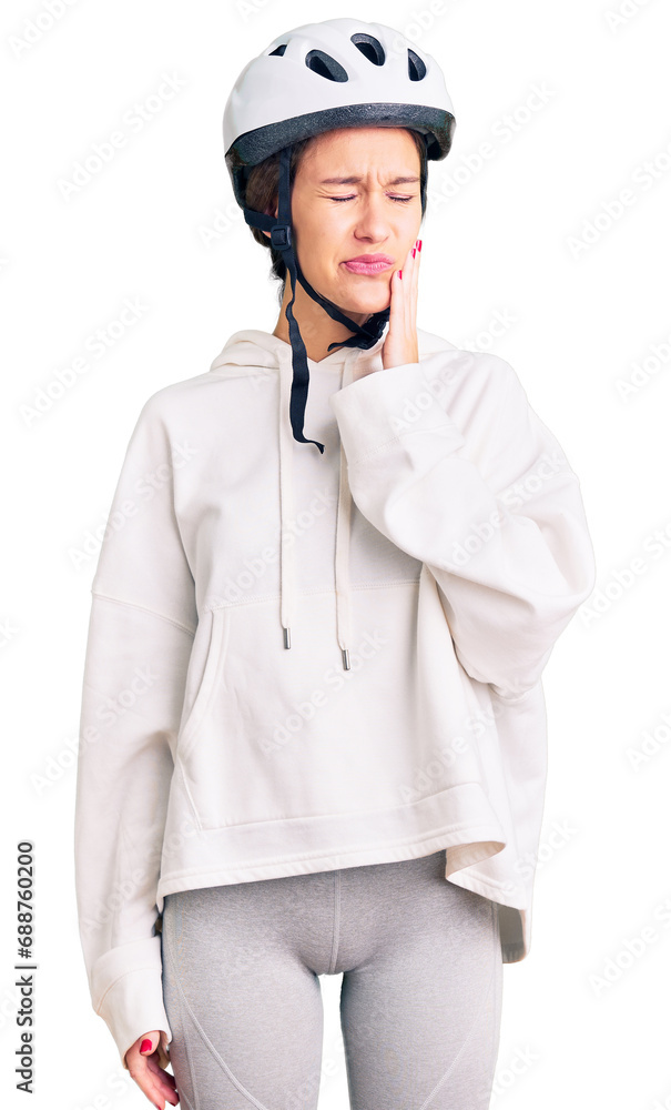 Beautiful brunette young woman wearing bike helmet and sporty clothes touching mouth with hand with painful expression because of toothache or dental illness on teeth. dentist Beautiful brunette young woman wearing bike helmet and sporty clothes touching mouth with hand with painful expression because of toothache or dental illness on teeth. dentist