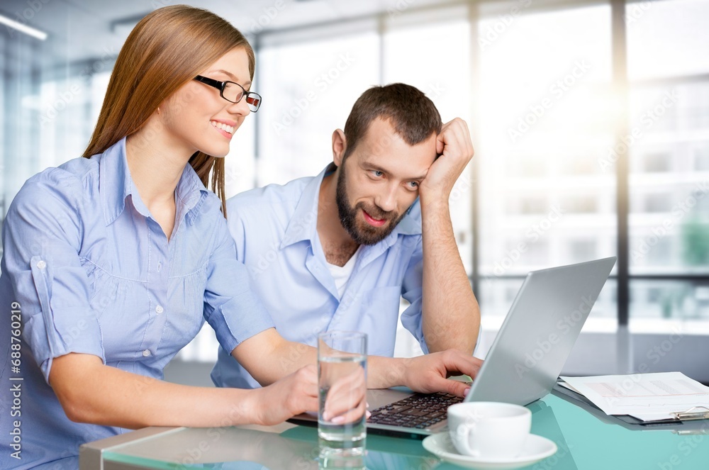 Mature manager mentor with young coworker, Mature manager mentor with young coworker,