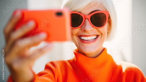 Generative AI image of stylish senior woman influencer taking a selfie