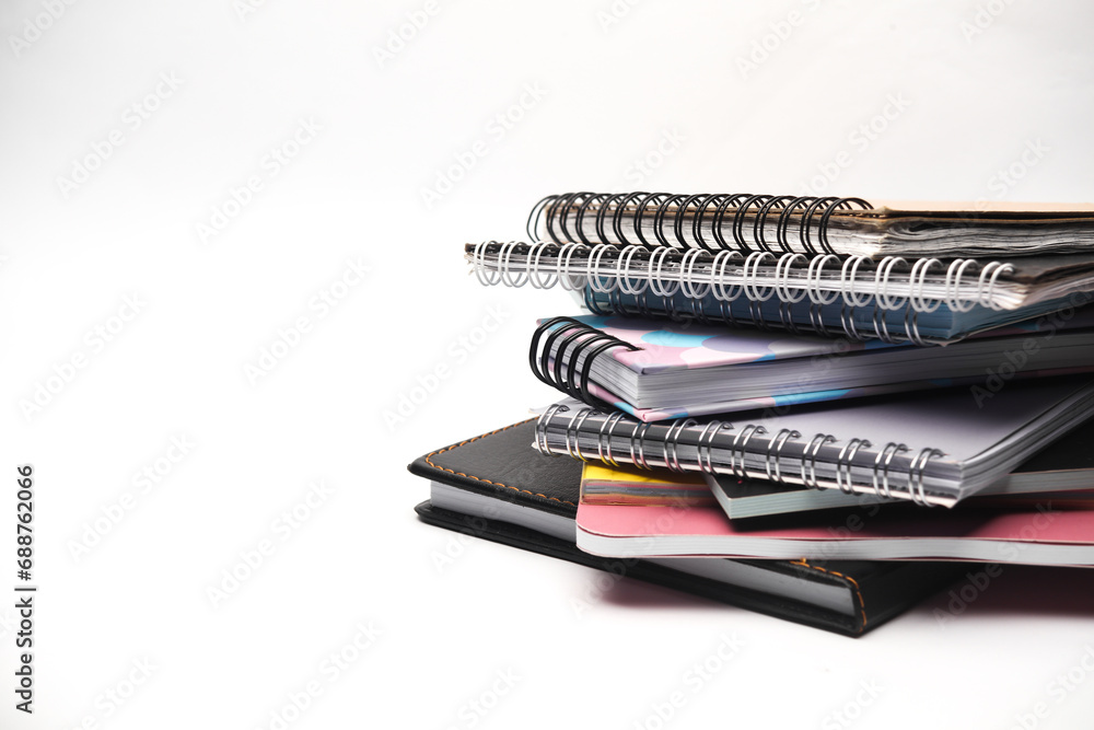 Stack of different notepads on white background Stack of different notepads on white background
