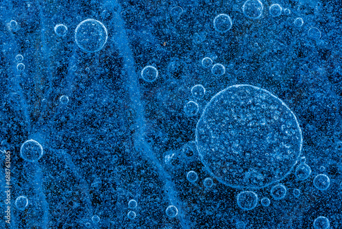 Top view of Blue bubbles under frozen water surface