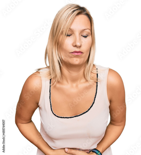 Middle age caucasian woman wearing casual clothes with hand on stomach because indigestion, painful illness feeling unwell. ache concept.