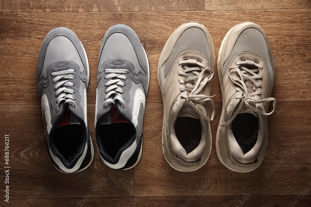 Two pair of running sneakers on the floor Two pair of running sneakers on the floor