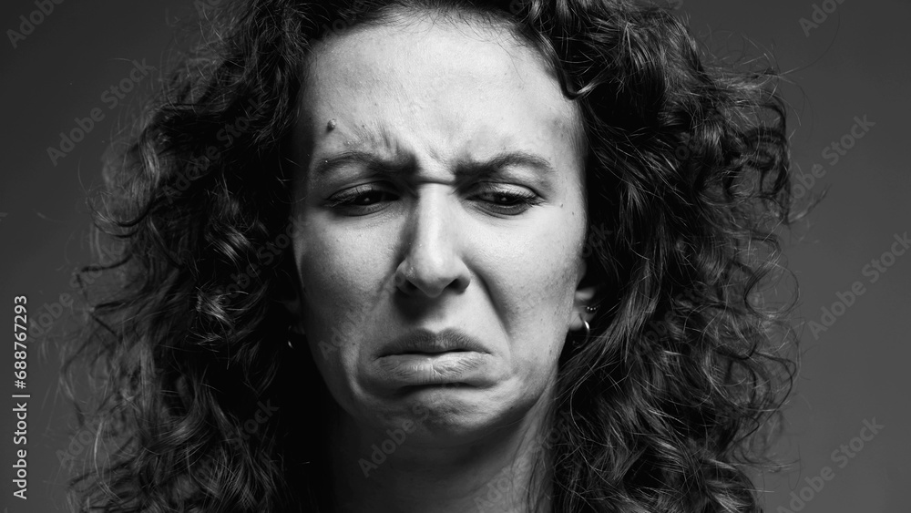 Female Expressing Extreme Aversion, Disgusted Reaction Portrait in black and white, monochromatic clip