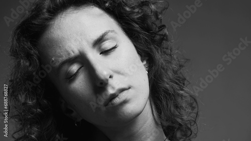 Person experiencing stiff neck, woman having body pain in black and white