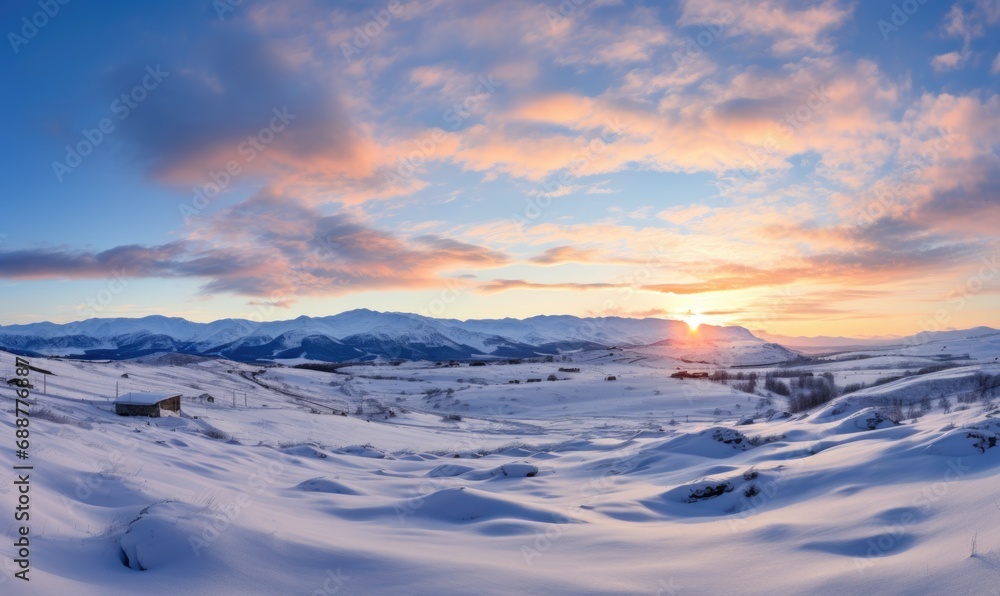 Beautiful winter landscape in the mountains. Sunset over the valley.