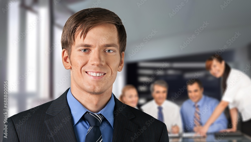Successful confident businessman posing in office Successful confident businessman posing in office