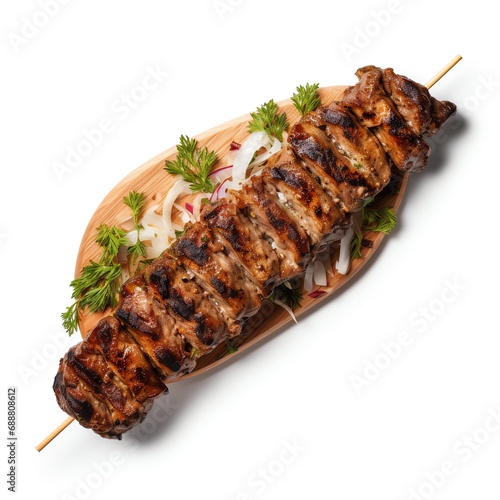 a skewer of meat and vegetables on a wooden platter