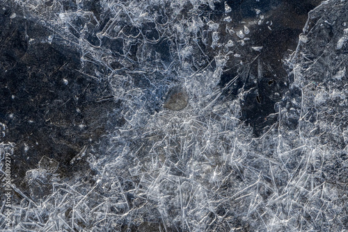Intricate ice patterns on a frozen surface photo