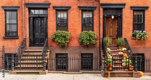 Typical Greenwich Village houses in New York with entrance staircase and wooden doors