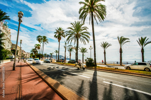 Fototapeta Naklejka Na Ścianę i Meble -  Amazing  Promenade des Anglais with fantastic palm trees, auto road  along coastline of Nice beach