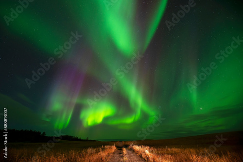 Majestic aurora borealis over the Icelandic landscape photo