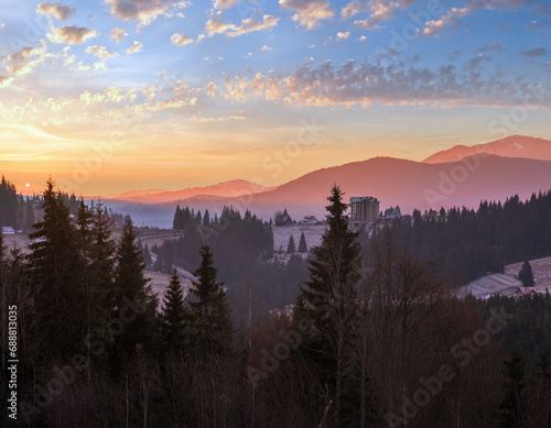 Picturesque sunrise above late autumn mountain countryside. Ukraine, Carpathian Mountains. Peaceful traveling, seasonal, nature and countryside beauty concept scene.