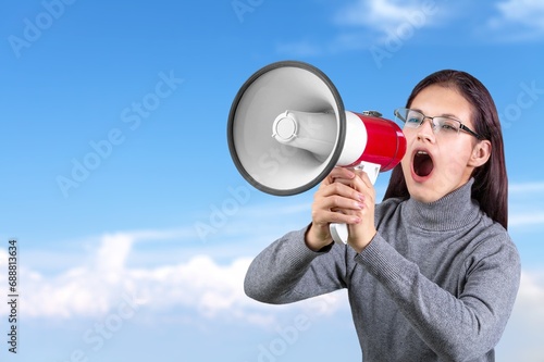 Young teen student scream in megaphone