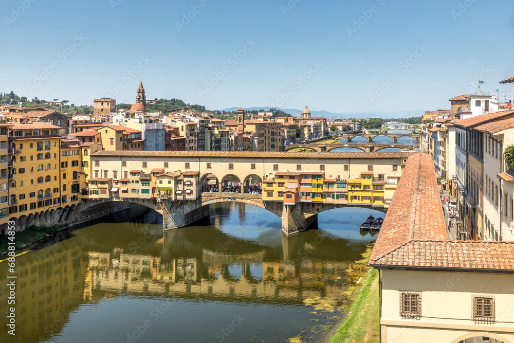 Florence, Italy - July 15, 2023: Ponte Vecchio bridge over Arno river in Florence, Italy